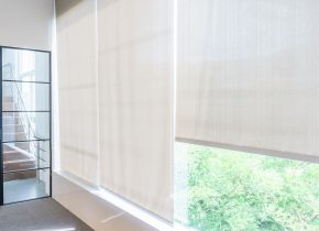Roll Blinds on the windows, the sun does not penetrate the house. Window in the Interior Roller Blinds. Beautiful Blinds on the Window